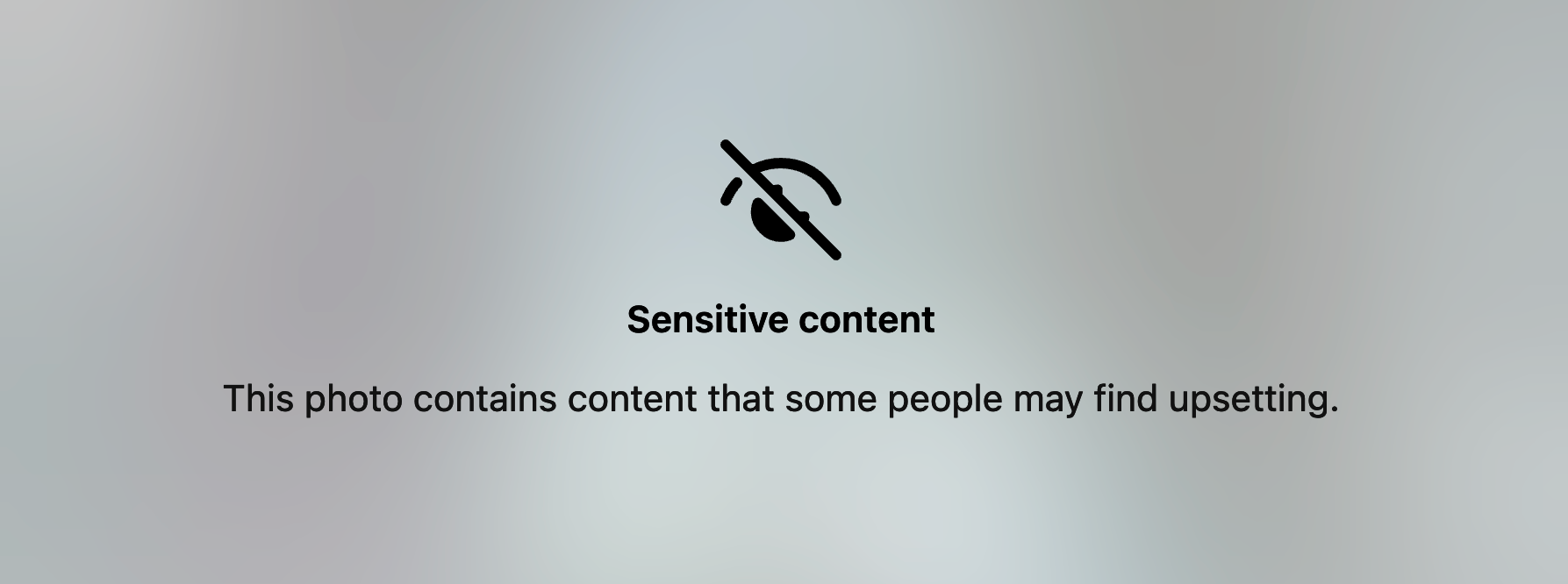A screenshot from an Instagram notice saying 'Sensitive content' with a blurred picture behind it.