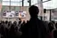 Ada Ada Ada is speaking to a crowd with black and white videos in the back. Photo by Frida Gregersen. Ada Ada Ada is speaking to a crowd with black and white videos in the back. Photo by Frida Gregersen.